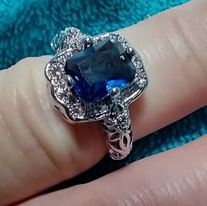 Silvertone blue stone intricate ring